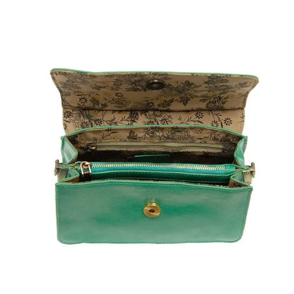 Open green leather ARIA RING BAG showcasing interior zip, ideal for women’s boho chic clothing