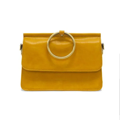 Yellow leather ARIA RING BAG with circular handle, ideal for women’s boho chic clothing