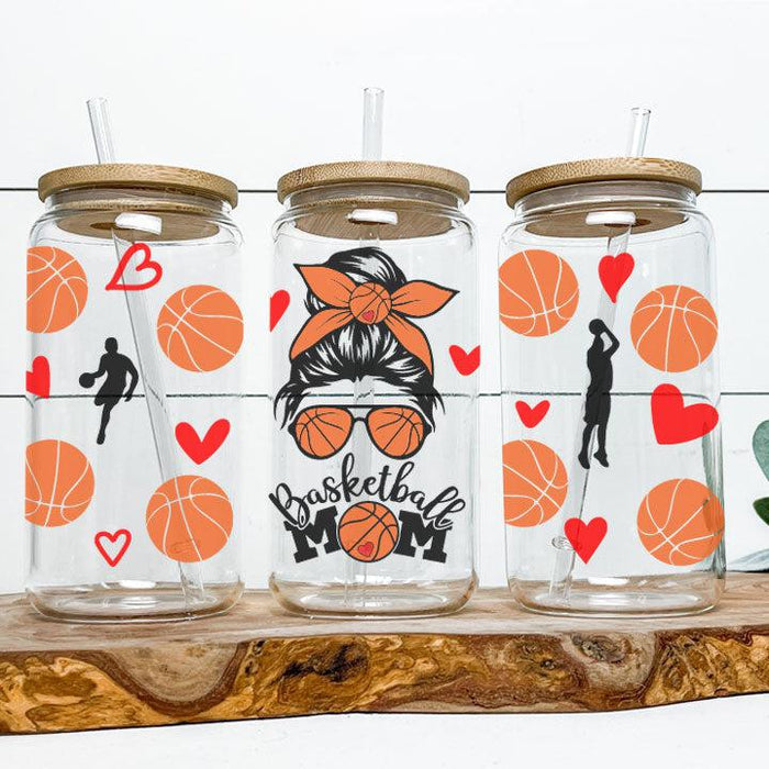 Fun basketball mom tumbler with messy bun and sunglasses illustration.