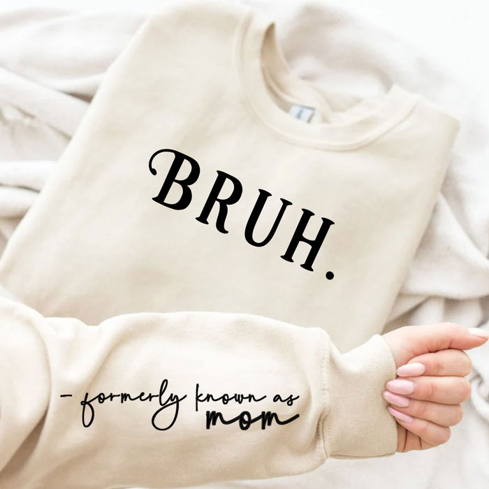 Sweatshirt sleeve detail with quote “formerly known as mom.”