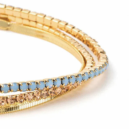 Gold-toned Dainty Gold and Rhinestone Layered Bracelet Set with light blue crystal stones