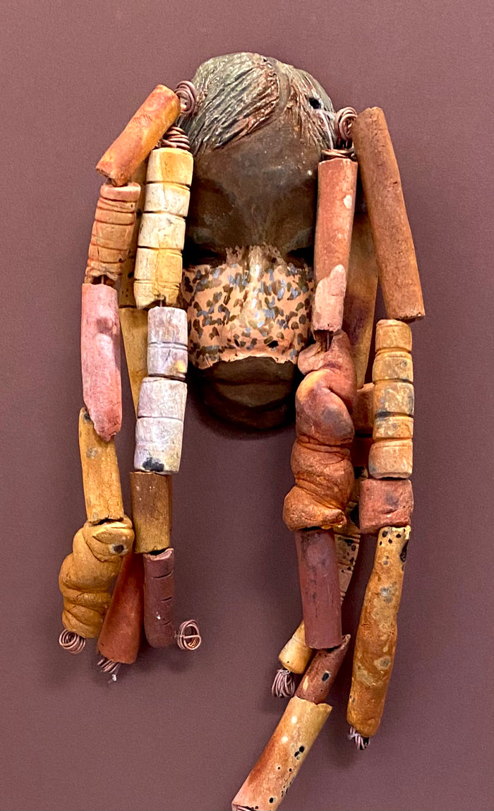 Meet Esi! I started making art soon after seeing authentic African artwork at the Smithsonian Museum of African Art. I was in total awe. Esi was inspired by my visit there.   Esi has a beautiful two tone speckled complexion. He is approximately 5" x 12" and weighs 13 ozs. Esi has an earthy handmade textured clay dreadlocks along with twist of coiled 16 gauge wire.