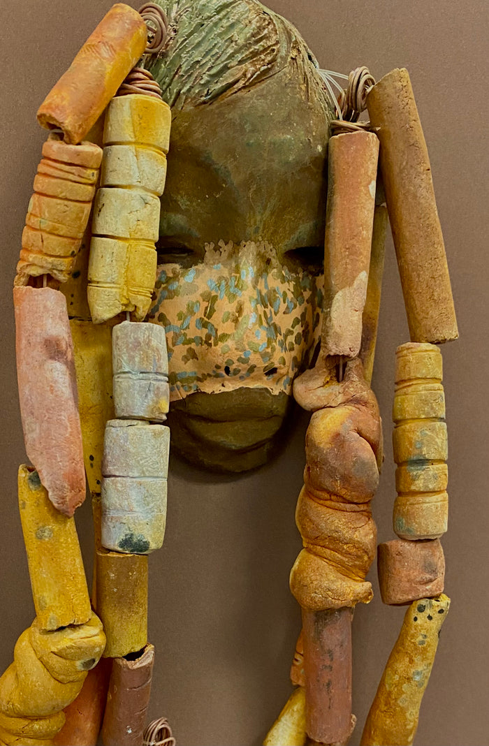 Meet Esi! I started making art soon after seeing authentic African artwork at the Smithsonian Museum of African Art. I was in total awe. Esi was inspired by my visit there.   Esi has a beautiful two tone speckled complexion. He is approximately 5" x 12" and weighs 13 ozs. Esi has an earthy handmade textured clay dreadlocks along with twist of coiled 16 gauge wire.