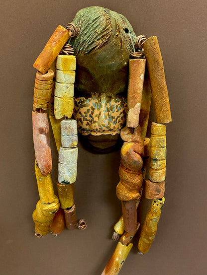 Meet Esi! I started making art soon after seeing authentic African artwork at the Smithsonian Museum of African Art. I was in total awe. Esi was inspired by my visit there.   Esi has a beautiful two tone speckled complexion. He is approximately 5" x 12" and weighs 13 ozs. Esi has an earthy handmade textured clay dreadlocks along with twist of coiled 16 gauge wire.