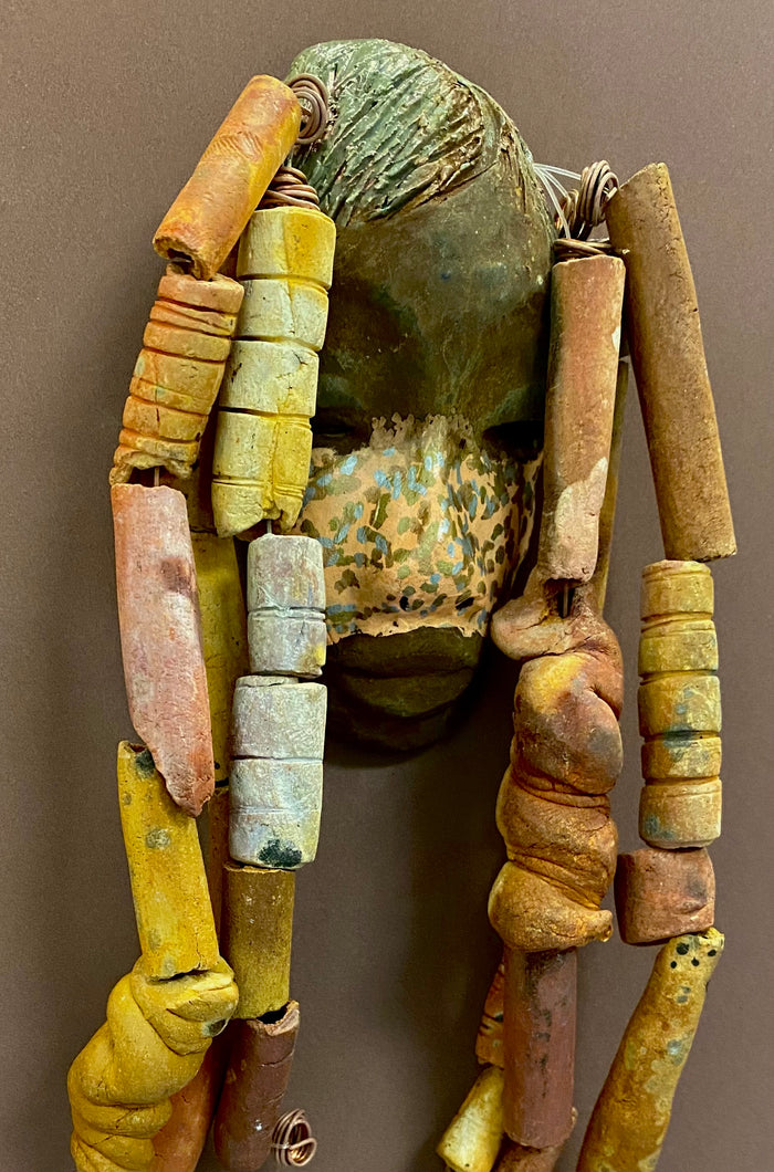 Meet Esi! I started making art soon after seeing authentic African artwork at the Smithsonian Museum of African Art. I was in total awe. Esi was inspired by my visit there.   Esi has a beautiful two tone speckled complexion. He is approximately 5" x 12" and weighs 13 ozs. Esi has an earthy handmade textured clay dreadlocks along with twist of coiled 16 gauge wire.