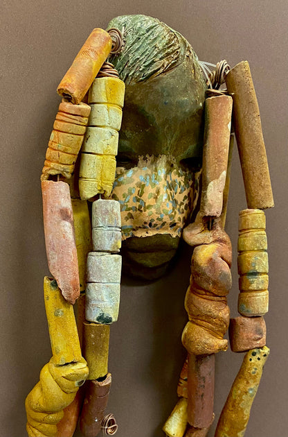 Meet Esi! I started making art soon after seeing authentic African artwork at the Smithsonian Museum of African Art. I was in total awe. Esi was inspired by my visit there.   Esi has a beautiful two tone speckled complexion. He is approximately 5" x 12" and weighs 13 ozs. Esi has an earthy handmade textured clay dreadlocks along with twist of coiled 16 gauge wire.
