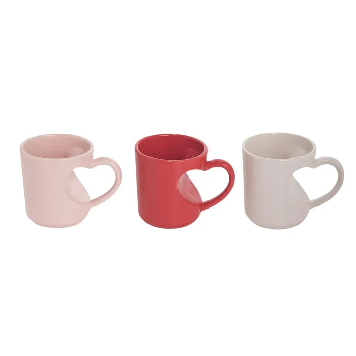 Three heart shaped mugs in pink, red, and white perfect for Valentine’s Day gifts