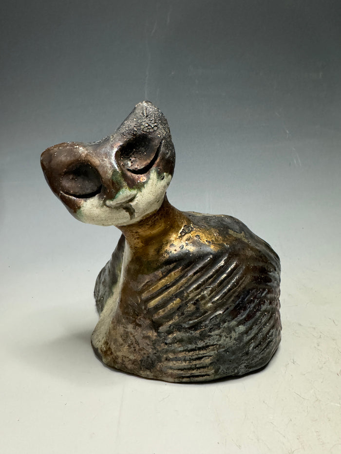 She's a pet with major  6" x 5" x 5" personality! This tiny wonder packs a powerful punch, boasting a stunning metallic patina and a lightweight design. Let her bring joy to any room with her endearing kitty cheer - she's sure to win your heart!