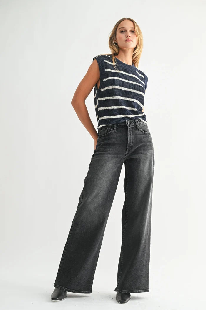 Women’s navy and white striped sleeveless sweater with high-rise wide-leg bohemian denim jeans