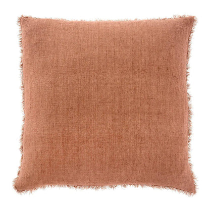 Terracotta square throw pillow with frayed edges perfect for a boho free spirit decor