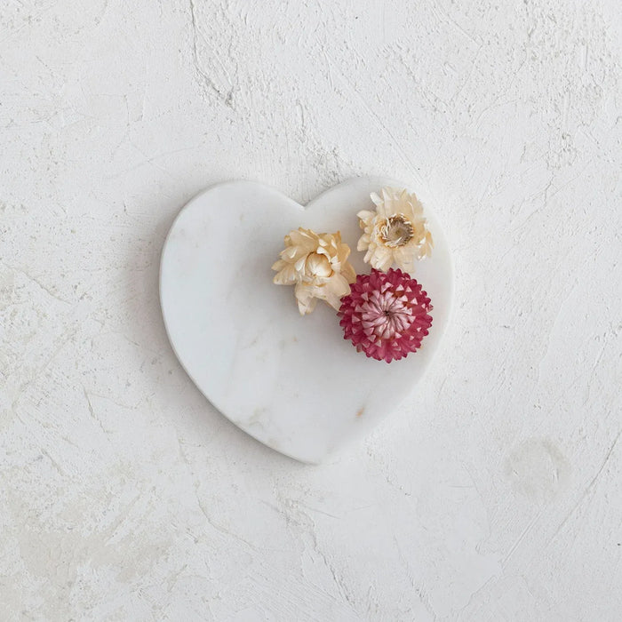 White flowers elegantly arranged on a Marble Heart Shaped Dish with a heart shaped design