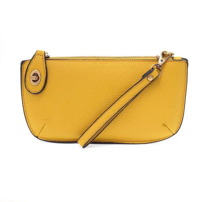 Yellow faux-leather wristlet clutch with card slots from Shop Daisy for women’s boho chic clothing