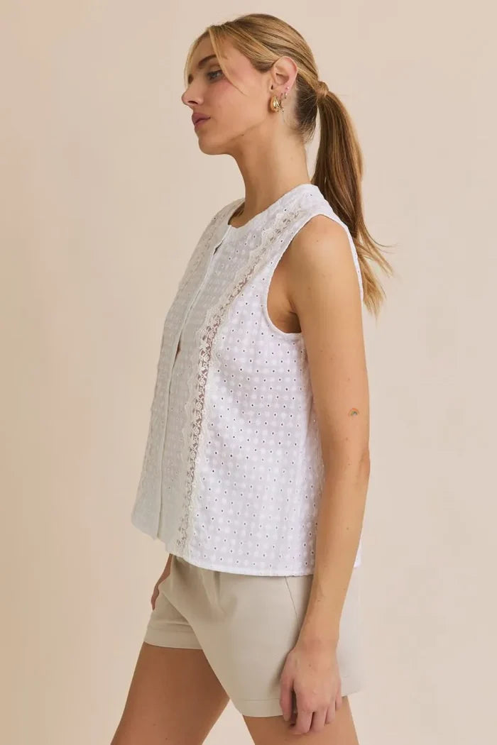 White eyelet sleeveless top from Round Neck Lace Trim Detail Button Up Eyelet Top, perfect for women’s boho chic clothing from Shop Daisy