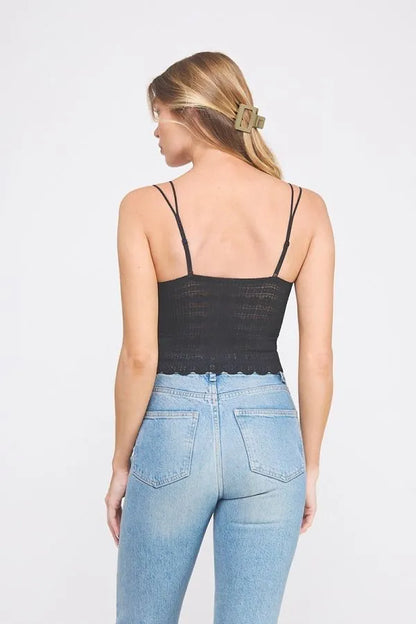 Woman wearing a daisy lanes scallop edge bralette with whimsical trim and flirty silhouette