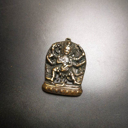 Thokcha Amulet Pendant,Mahakala, Buddhist Protector Deity, Made of Thunder Iron - Tibetan Buddhist amulet, close-up detail